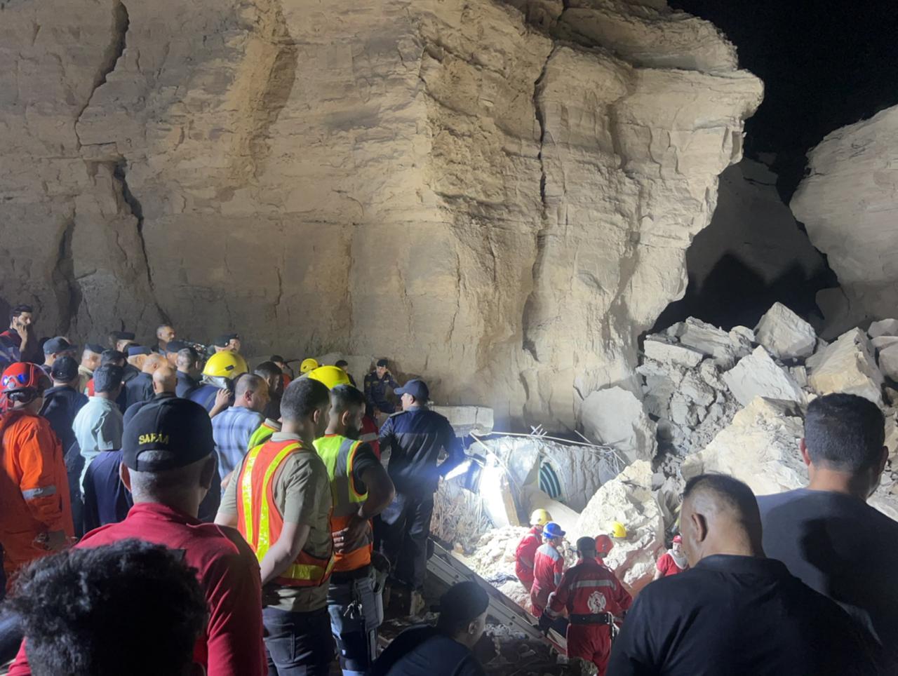 Frantic rescue effort under way at Iraq shrine hit by landslide